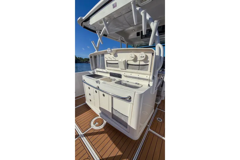  Yacht Photos Pics 2017 Boston Whaler 370 Outrage boat deck with fishing station and storage.