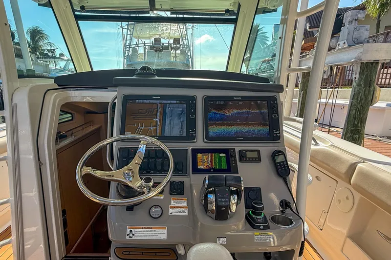  Yacht Photos Pics 2017 Boston Whaler 370 Outrage helm with advanced navigation displays and controls.