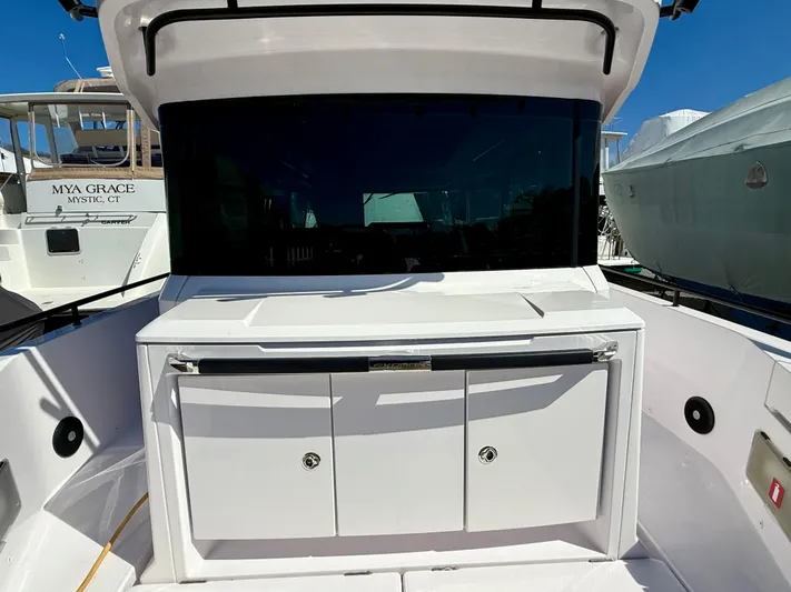  Yacht Photos Pics 2021 Axopar 37 boat with sleek design and spacious deck area.