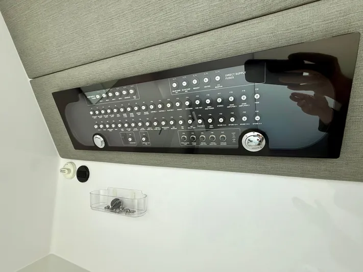  Yacht Photos Pics Control panel of a 2021 Axopar 37 boat, featuring various switches and dials.