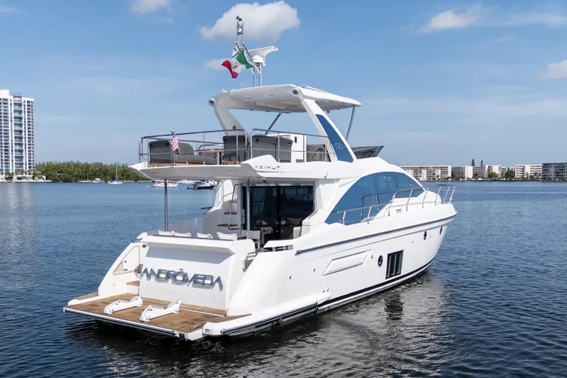 Andromeda Yacht Photos Pics 2023 Azimut Fly 50 yacht on calm water, showcasing sleek design and luxury features.