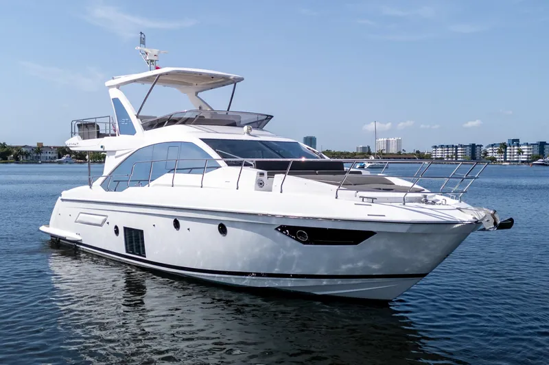 Andromeda Yacht Photos Pics 2023 Azimut Fly 50 yacht on calm water, showcasing sleek design and luxury features.