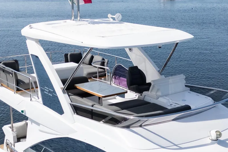 Andromeda Yacht Photos Pics 2023 Azimut Fly 50 yacht with spacious flybridge and luxurious seating on the water.