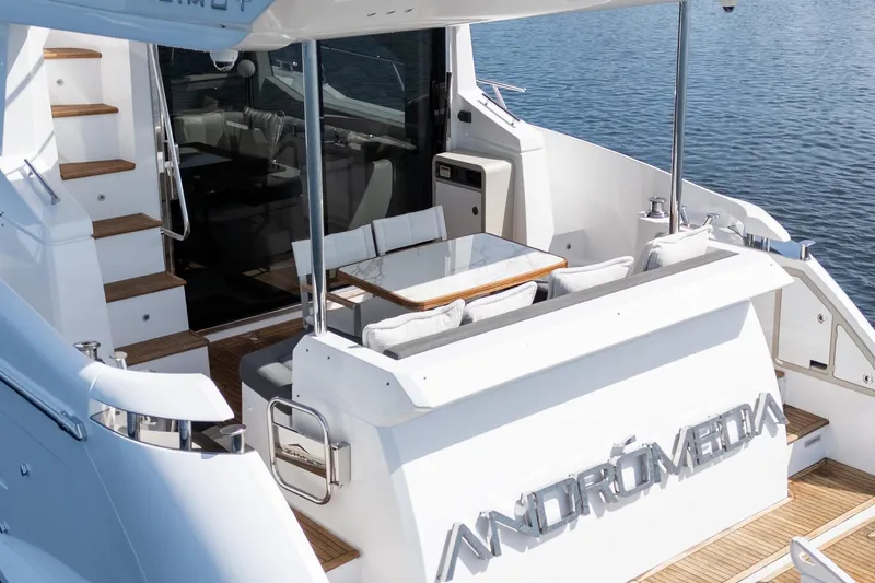 Andromeda Yacht Photos Pics 2023 Azimut Fly 50 yacht with elegant outdoor seating and sleek design.