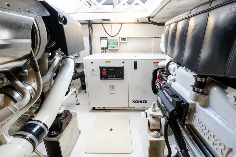 Andromeda Yacht Photos Pics Engine room of 2023 Azimut Fly 50 yacht featuring Kohler generator and mechanical components.
