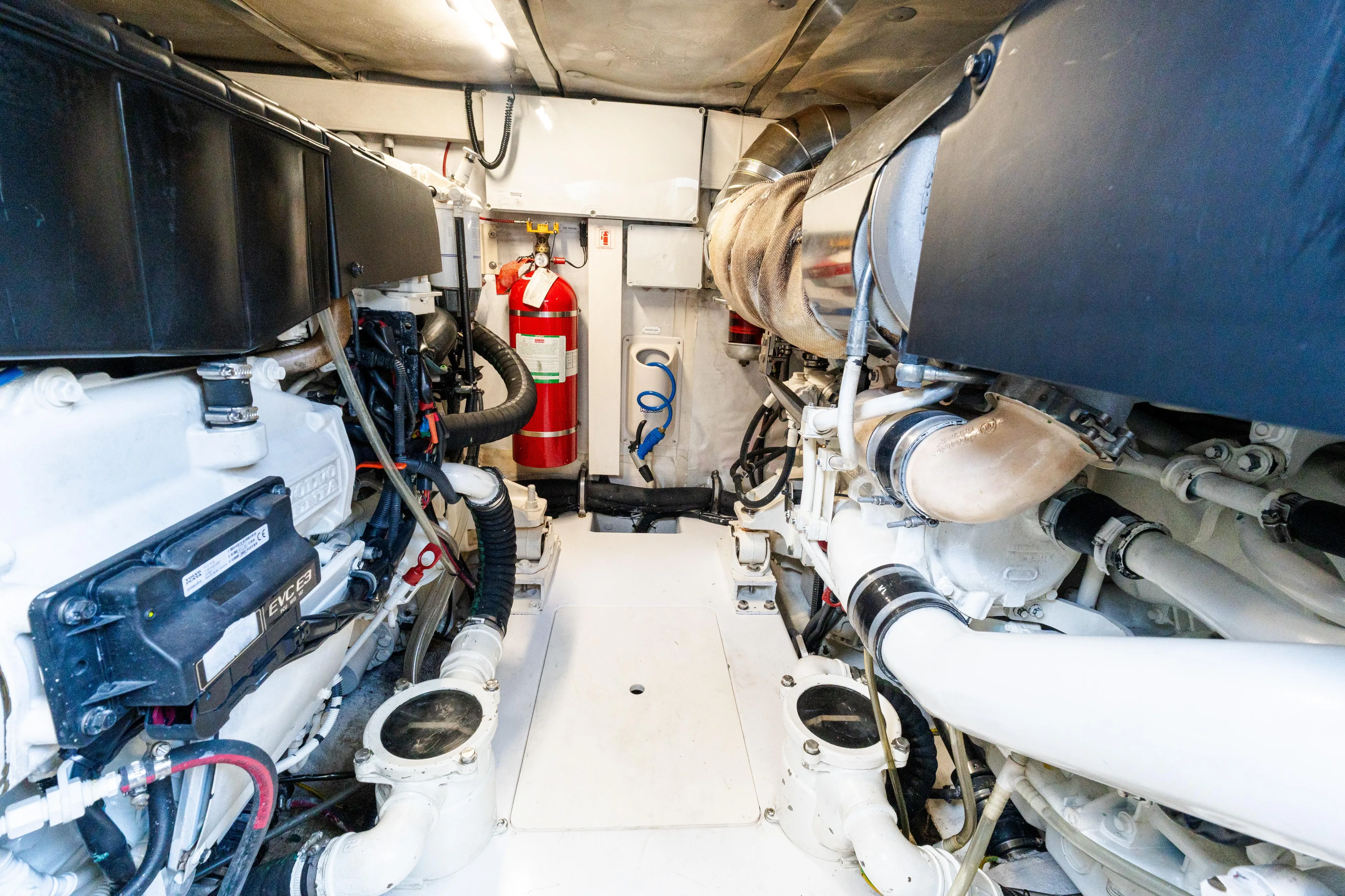 Andromeda Yacht Photos Pics Engine room of 2023 Azimut Fly 50 yacht, featuring modern equipment and fire extinguisher.
