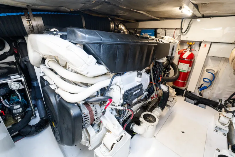 Andromeda Yacht Photos Pics Engine room of 2023 Azimut Fly 50 yacht, featuring modern equipment and fire extinguisher.