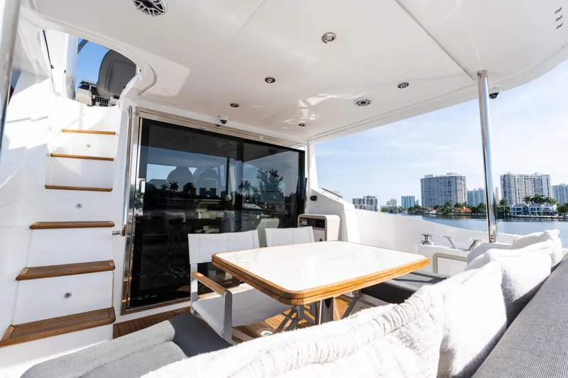 Andromeda Yacht Photos Pics Luxurious 2023 Azimut Fly 50 yacht interior with elegant seating and scenic waterfront view.