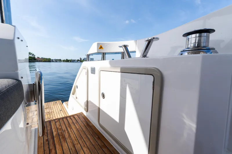 Andromeda Yacht Photos Pics 2023 Azimut Fly 50 yacht deck with wooden flooring and water view.