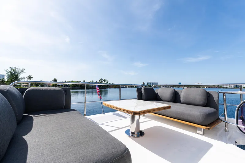 Andromeda Yacht Photos Pics Luxurious seating area on 2023 Azimut Fly 50 yacht with scenic waterfront view.