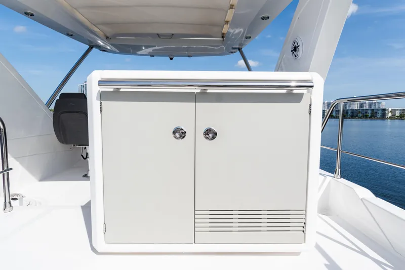 Andromeda Yacht Photos Pics 2023 Azimut Fly 50 yacht deck with storage cabinet and scenic water view.