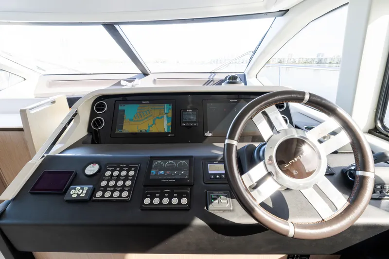 Andromeda Yacht Photos Pics 2023 Azimut Fly 50 yacht helm with navigation controls and steering wheel.