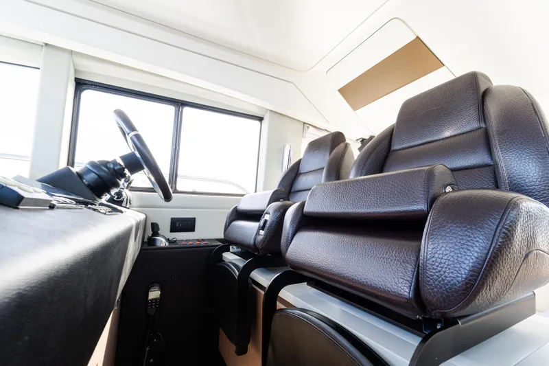 Andromeda Yacht Photos Pics Interior of 2023 Azimut Fly 50 yacht with luxurious leather seating and modern controls.