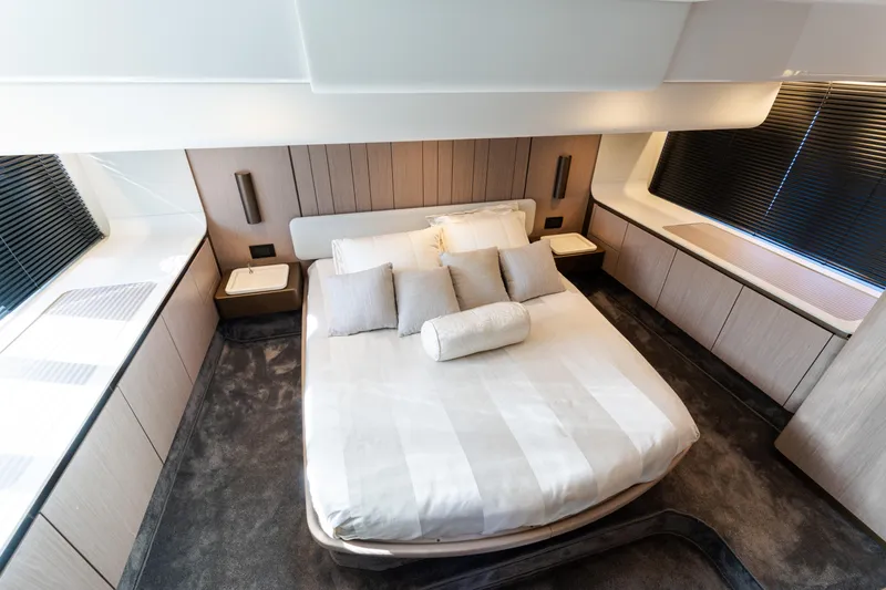 Andromeda Yacht Photos Pics Luxurious bedroom interior of 2023 Azimut Fly 50 yacht with modern design and elegant furnishings.