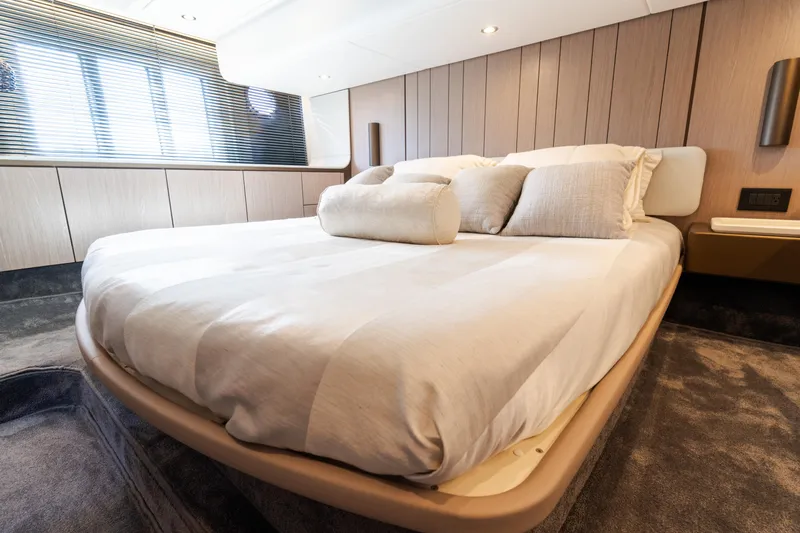 Andromeda Yacht Photos Pics Luxurious bedroom interior of 2023 Azimut Fly 50 yacht with modern design.