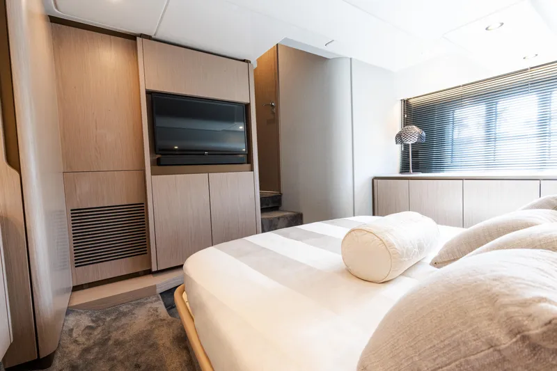 Andromeda Yacht Photos Pics Luxurious bedroom interior of 2023 Azimut Fly 50 yacht with modern design and elegant furnishings.