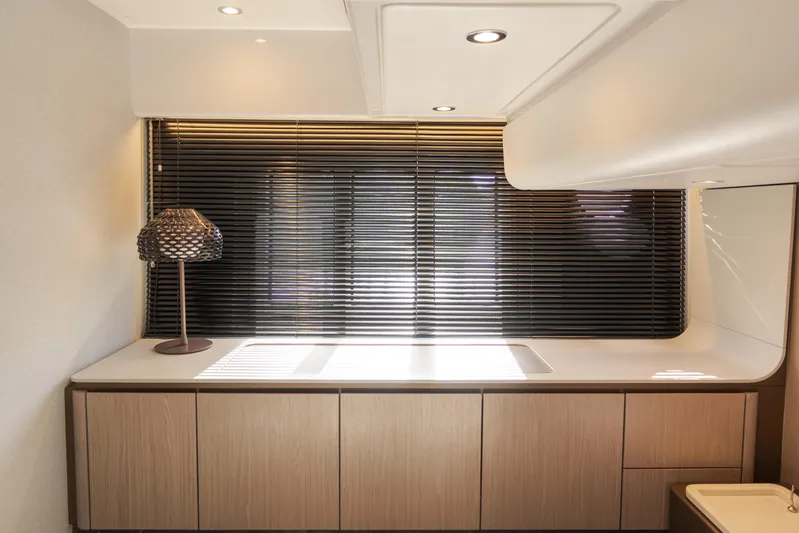 Andromeda Yacht Photos Pics Modern interior of 2023 Azimut Fly 50 yacht with sleek cabinetry and stylish lamp.