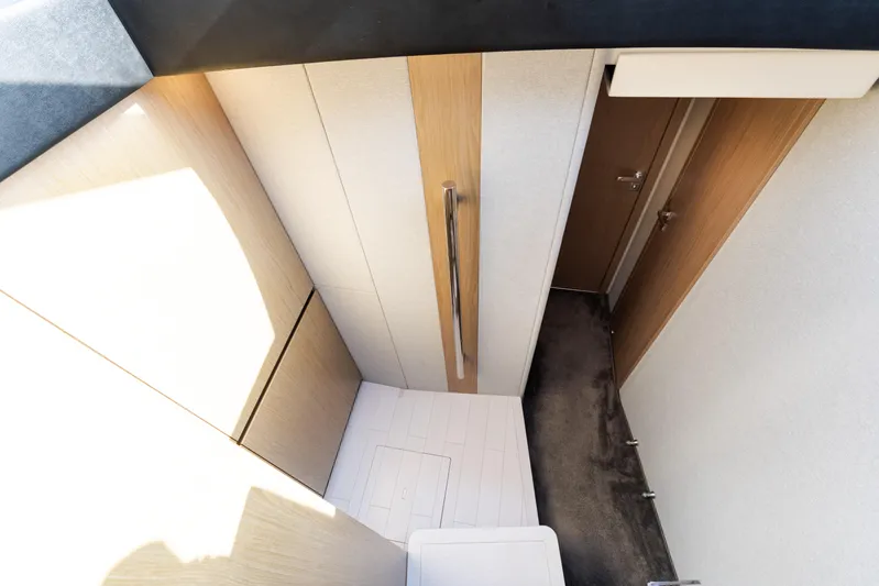 Andromeda Yacht Photos Pics Interior view of 2023 Azimut Fly 50 yacht, featuring modern wood paneling and sleek design.