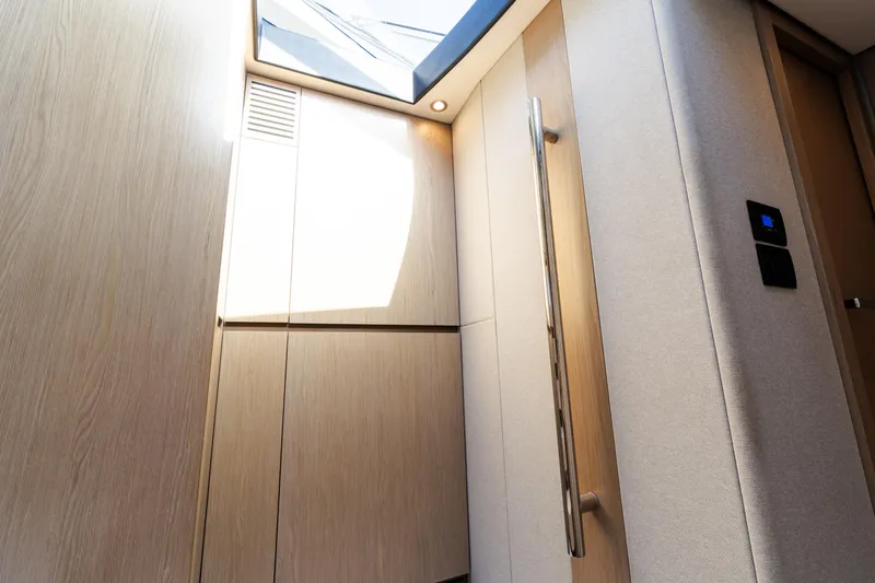 Andromeda Yacht Photos Pics Interior of 2023 Azimut Fly 50 yacht, featuring modern wood paneling and skylight.