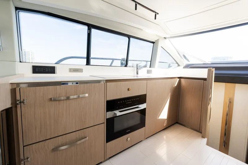 Andromeda Yacht Photos Pics Modern kitchen interior of 2023 Azimut Fly 50 yacht with sleek cabinetry and appliances.
