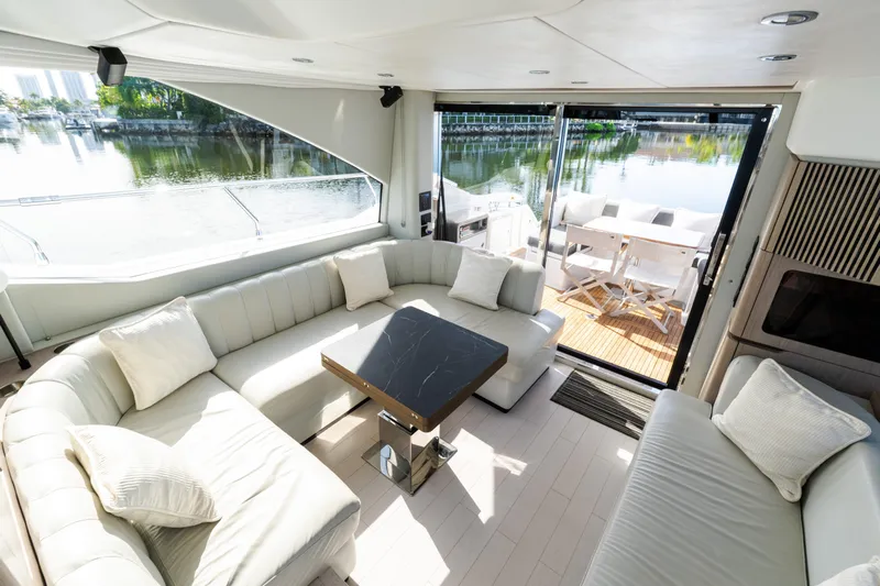 Andromeda Yacht Photos Pics Luxurious interior of 2023 Azimut Fly 50 yacht with elegant seating and scenic water view.
