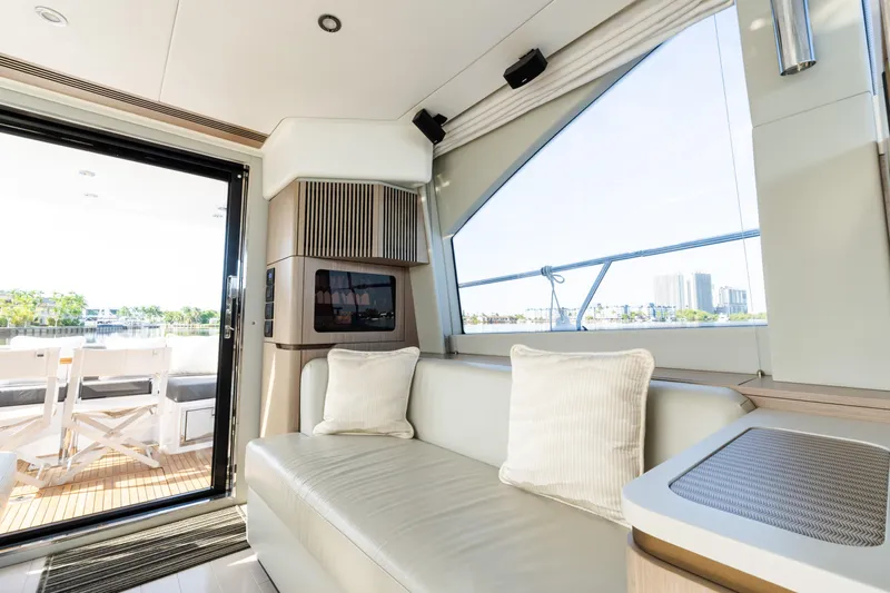 Andromeda Yacht Photos Pics Luxurious interior of 2023 Azimut Fly 50 yacht with modern seating and large windows.