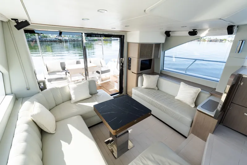 Andromeda Yacht Photos Pics Luxurious interior of 2023 Azimut Fly 50 yacht with elegant seating and scenic water view.