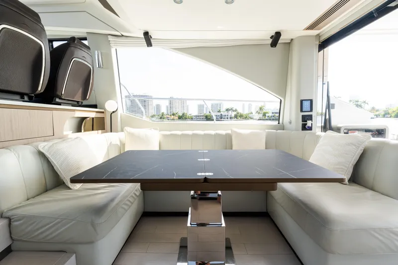 Andromeda Yacht Photos Pics Luxurious interior of 2023 Azimut Fly 50 yacht with elegant seating and modern table.