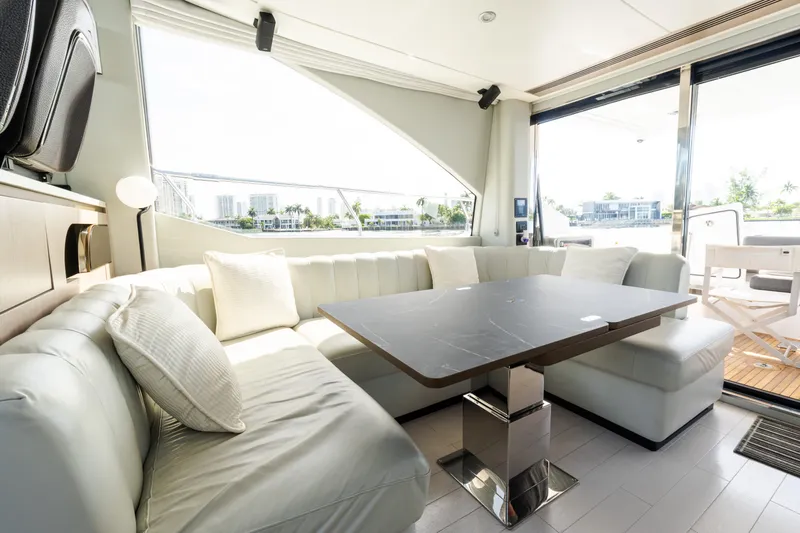 Andromeda Yacht Photos Pics Luxurious interior of 2023 Azimut Fly 50 yacht with elegant seating and modern table.