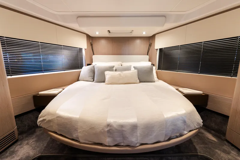 Andromeda Yacht Photos Pics Luxurious bedroom interior of 2023 Azimut Fly 50 yacht with modern design.