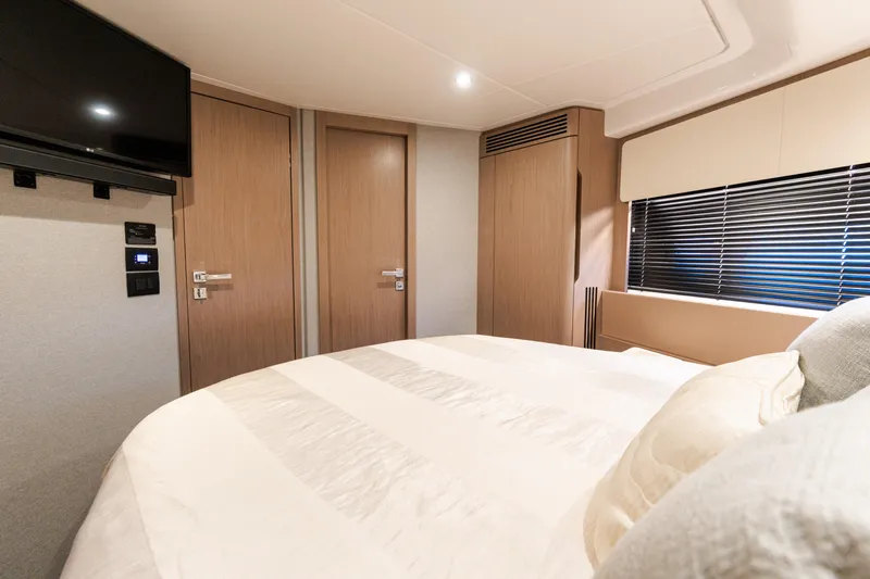 Andromeda Yacht Photos Pics Luxurious bedroom interior of 2023 Azimut Fly 50 yacht with modern design.
