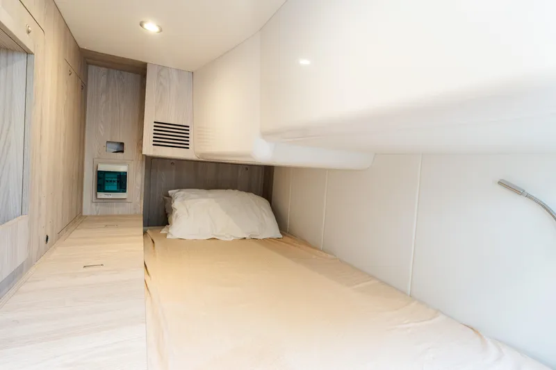 Andromeda Yacht Photos Pics 2023 Azimut Fly 50 yacht cabin interior with modern design and cozy bedding.