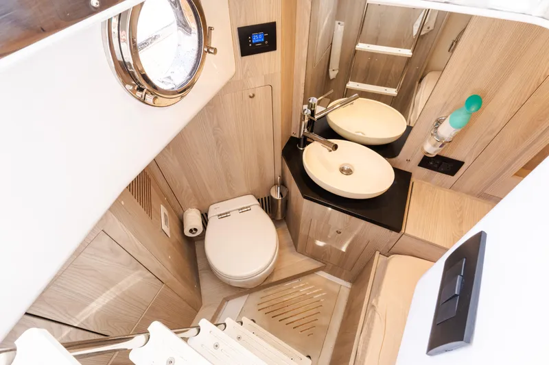 Andromeda Yacht Photos Pics Luxurious bathroom in 2023 Azimut Fly 50 yacht with modern fixtures and elegant design.