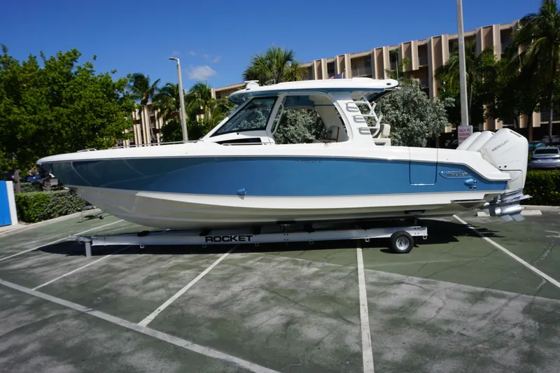 Bwce0015f324 Yacht Photos Pics 2024 Boston Whaler 350 Realm boat on a trailer in a parking lot.