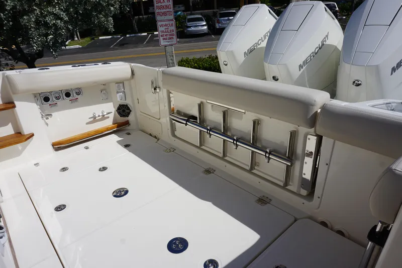 Bwce0015f324 Yacht Photos Pics Boston Whaler 350 Realm 2024 boat deck with Mercury engines and fishing rod holders.