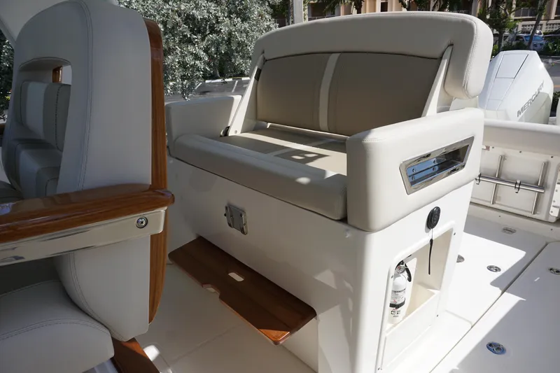 Bwce0015f324 Yacht Photos Pics 2024 Boston Whaler 350 Realm boat interior with cushioned seating and wooden accents.