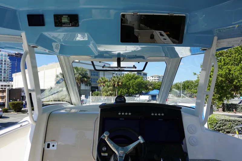 Bwce0015f324 Yacht Photos Pics 2024 Boston Whaler 350 Realm helm station with modern controls and cityscape background.