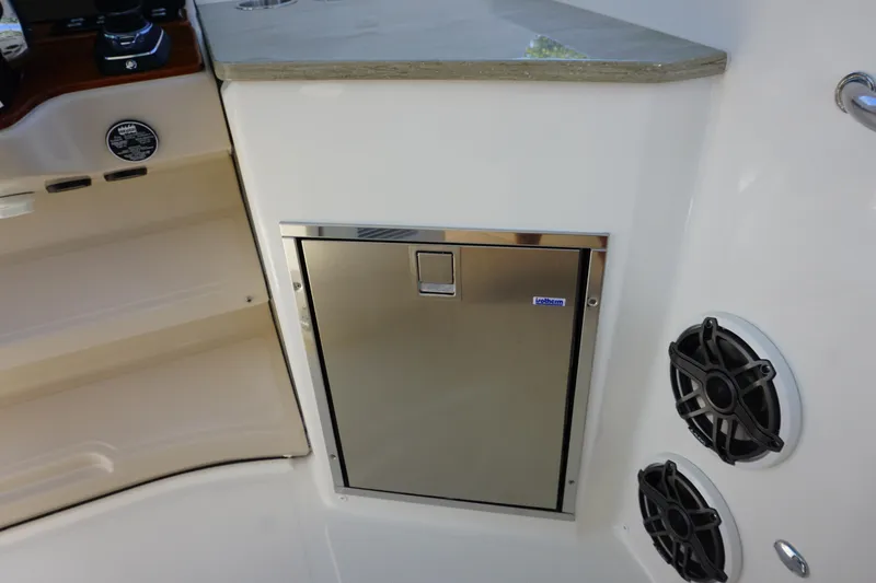 Bwce0015f324 Yacht Photos Pics 2024 Boston Whaler 350 Realm interior with stainless steel storage compartment and speakers.