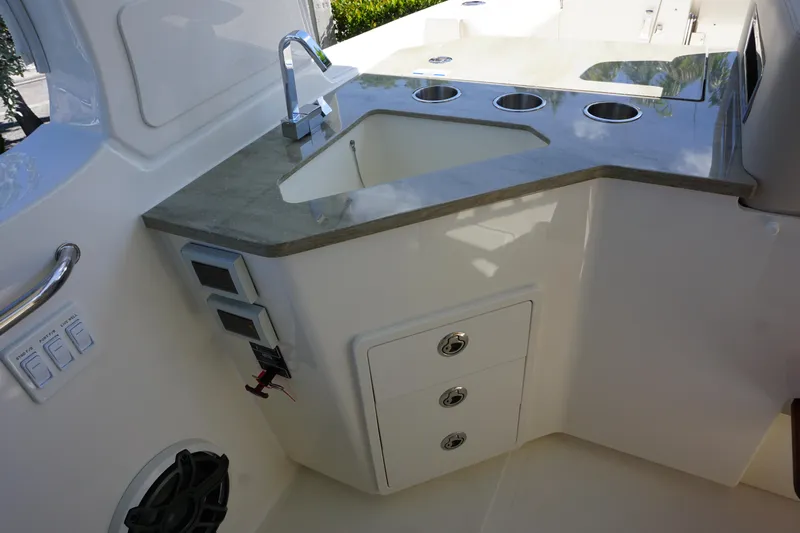 Bwce0015f324 Yacht Photos Pics 2024 Boston Whaler 350 Realm boat interior with sink and storage drawers.