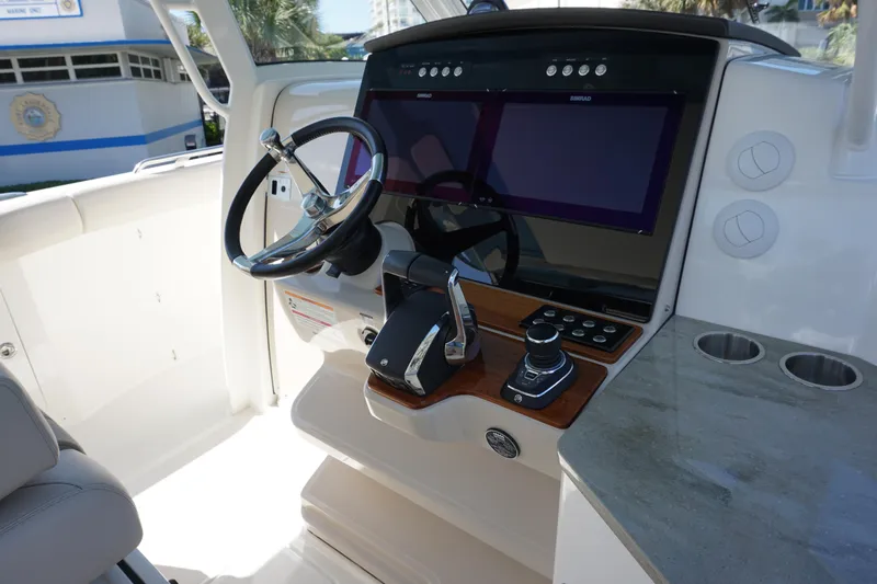 Bwce0015f324 Yacht Photos Pics 2024 Boston Whaler 350 Realm helm with dual screens and modern controls.