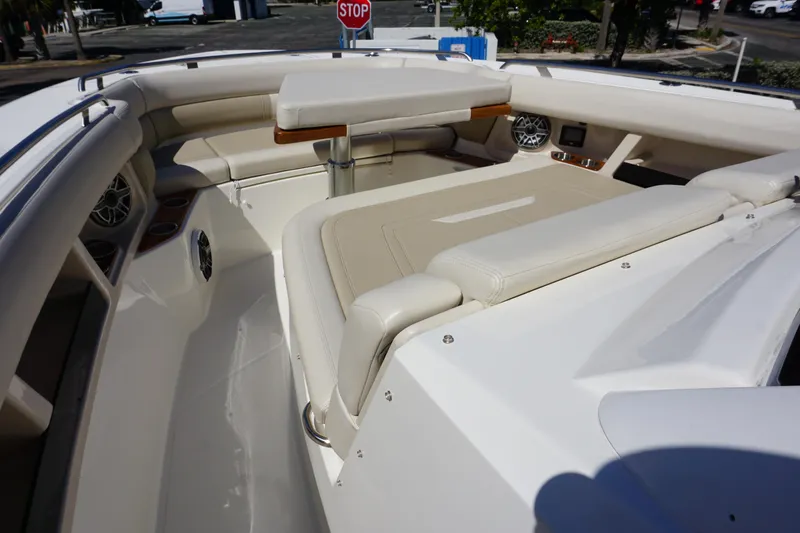 Bwce0015f324 Yacht Photos Pics 2024 Boston Whaler 350 Realm boat interior with beige seating and table.