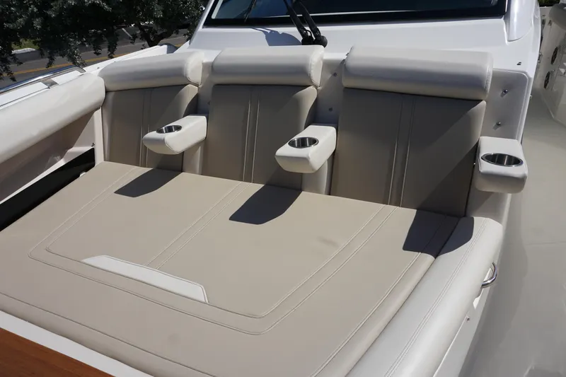 Bwce0015f324 Yacht Photos Pics 2024 Boston Whaler 350 Realm boat seating with cup holders and beige upholstery.