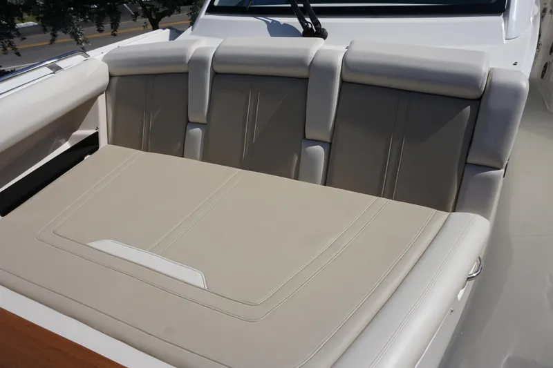 Bwce0015f324 Yacht Photos Pics 2024 Boston Whaler 350 Realm boat with beige cushioned seating area.