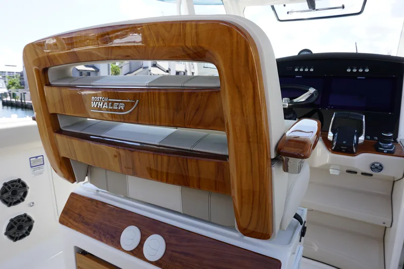 Bwce0015f324 Yacht Photos Pics 2024 Boston Whaler 350 Realm boat interior with luxurious wooden helm seat.