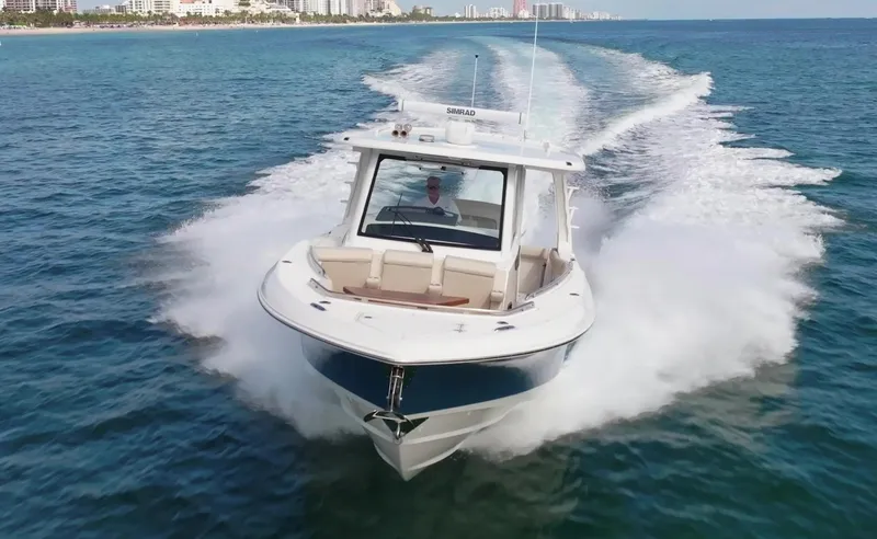 Bwce0015f324 Yacht Photos Pics 2024 Boston Whaler 350 Realm cruising on open water, showcasing sleek design and powerful performance.