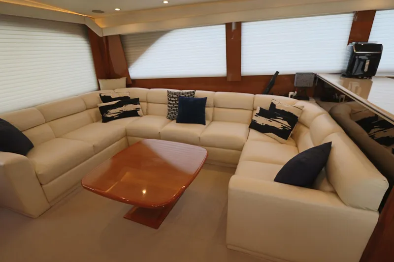 Angie Yacht Photos Pics Luxurious interior of a 2000 Viking 65 yacht with plush seating and elegant decor.