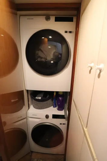 Angie Yacht Photos Pics Stacked washer and dryer in compact laundry space on Viking 65 yacht, 2000 model.
