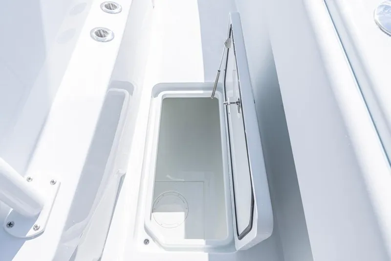  Yacht Photos Pics Open storage compartment on 2026 Invincible 33 Catamaran, showcasing sleek design and functionality.