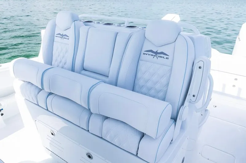  Yacht Photos Pics Luxurious seating on 2026 Invincible 33 Catamaran, featuring elegant white upholstery.