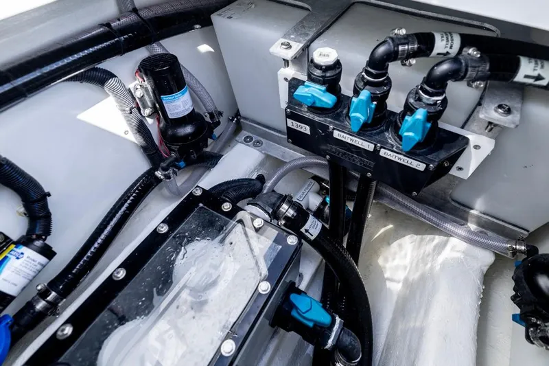  Yacht Photos Pics 2026 Invincible 33 Catamaran engine compartment with detailed plumbing and wiring systems.